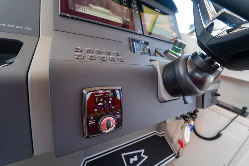 Slide: The Image of Dashboard of Nimbus T11 boat, 2022 model, featuring modern controls. - 11