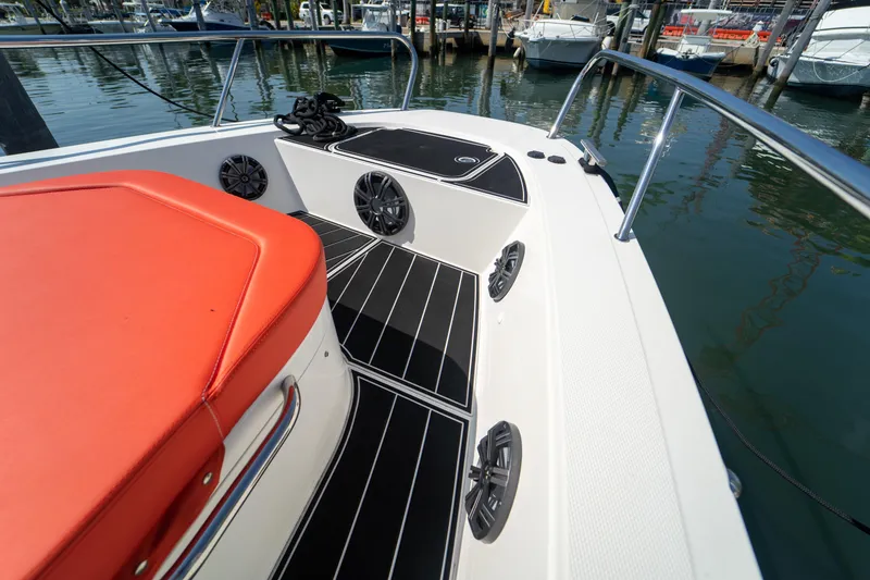 Slide: The Image of Deck of a 2022 Nimbus T11 boat with red seating. - 28