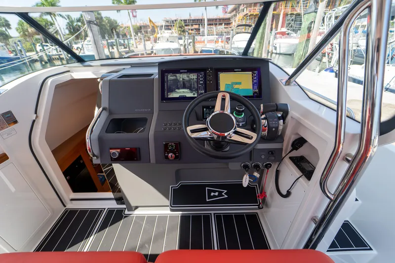 Slide: The Image of Cockpit of a 2022 Nimbus T11 boat with modern navigation technology. - 5
