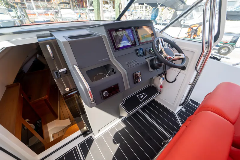 Slide: The Image of Interior of 2022 Nimbus T11 with red seat and control console. - 6