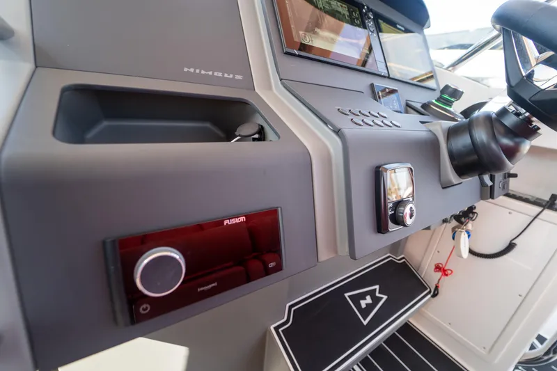 Slide: The Image of Dashboard of Nimbus T11 boat, 2022 model, featuring modern electronics. - 10