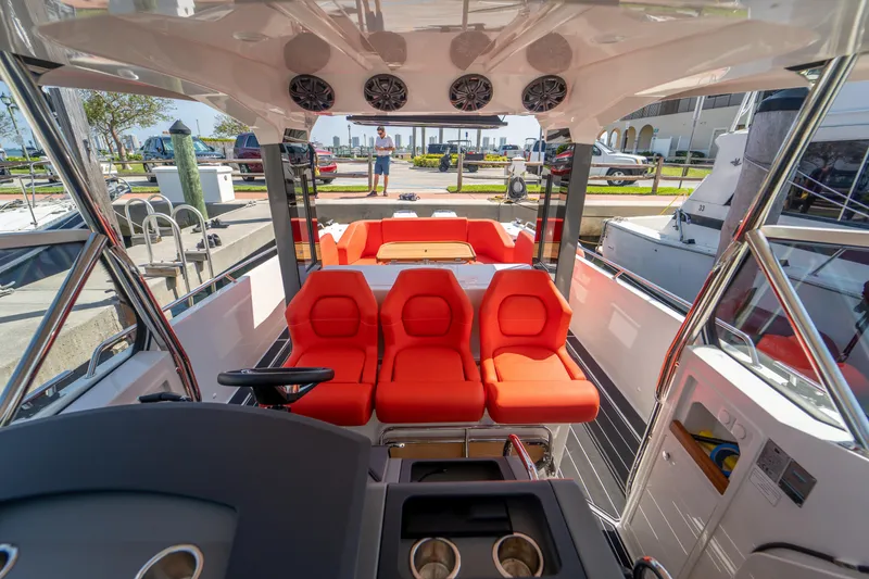 Slide: The Image of Interior of Nimbus T11 boat, 2022 model, featuring red seats. - 13