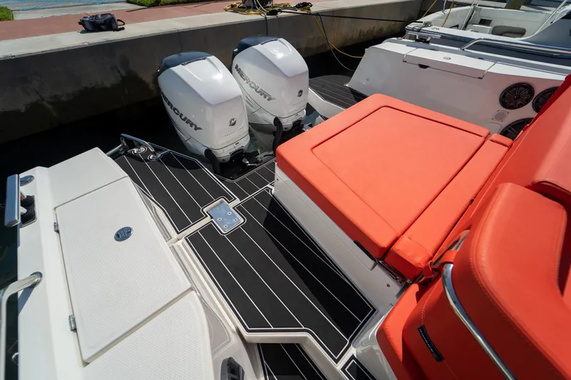 Slide: The Image of Nimbus T11 2022 with Mercury engines and orange seats at the dock. - 15