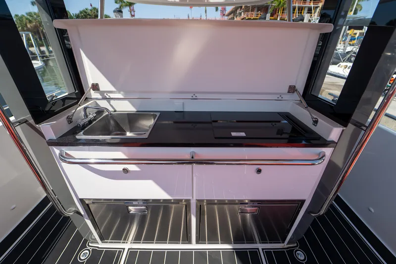 Slide: The Image of Kitchen area on a 2022 Nimbus T11 boat. - 22