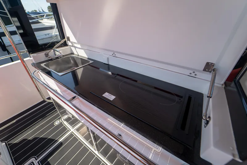 Slide: The Image of Kitchen area on a 2022 Nimbus T11 boat. - 23