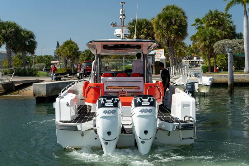 Slide: The Image of Nimbus T11 2022 motorboat with twin outboard engines in harbor. - 3
