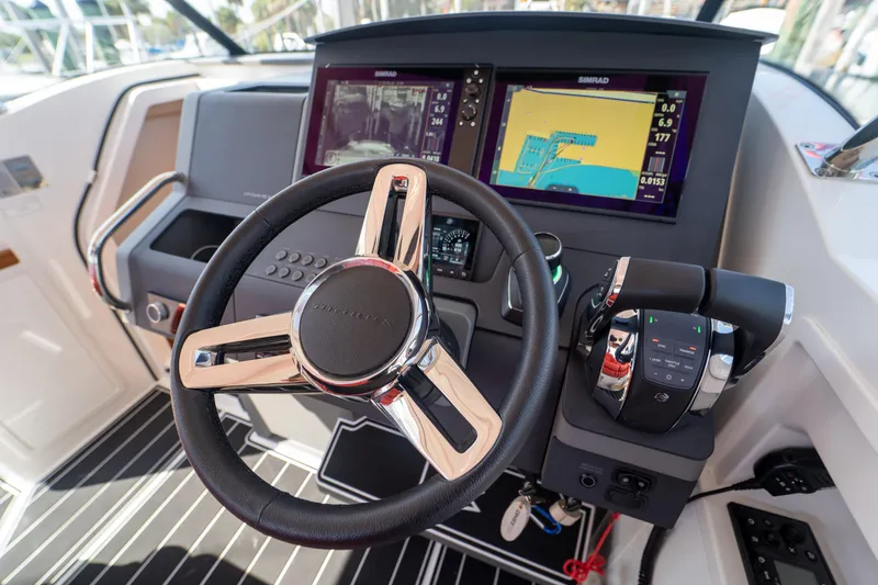 Slide: The Image of Nimbus T11 boat helm, 2022 model, featuring modern navigation systems. - 7