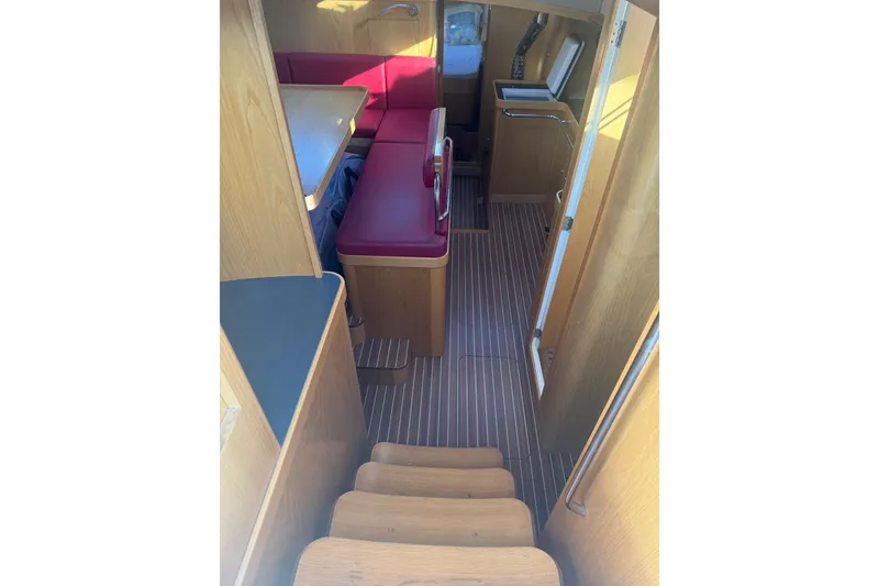 Slide: The Image of Interior of 2017 Boreal 47 yacht with wooden finish and red seating. - 14