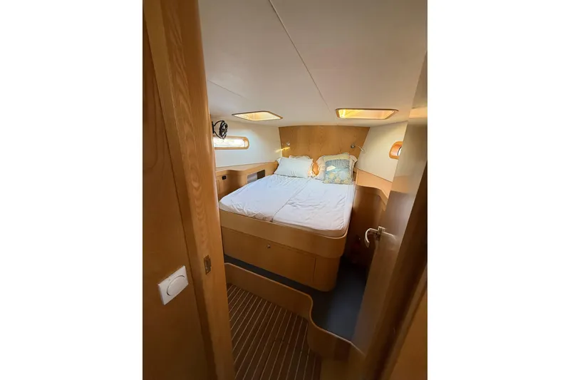 Slide: The Image of Cozy cabin interior of 2017 Boreal 47 yacht with double bed and wooden finish. - 23