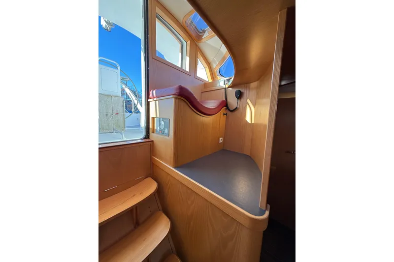 Slide: The Image of Interior of 2017 Boreal 47 sailboat with wooden finish and navigation equipment. - 25