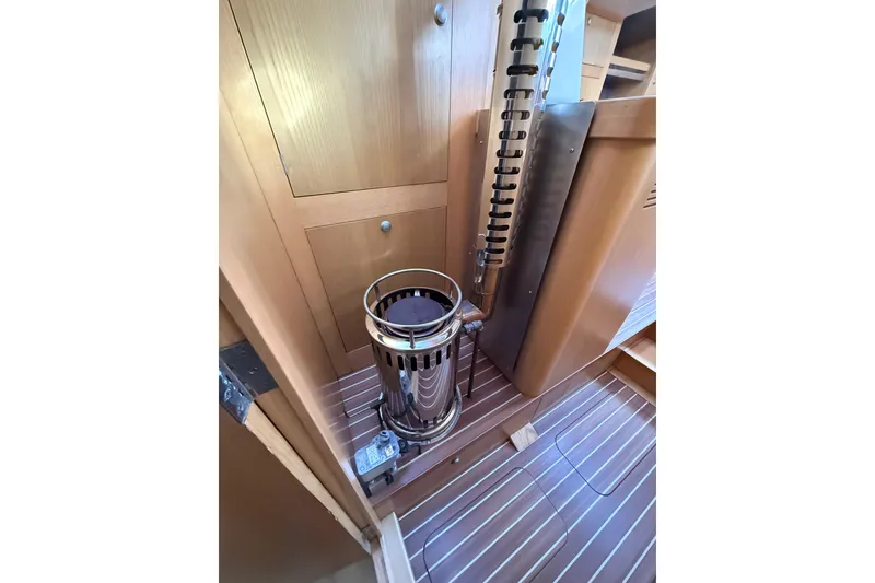 Slide: The Image of Wood-paneled interior of 2017 Boreal 47 yacht with a sleek metal heater. - 28