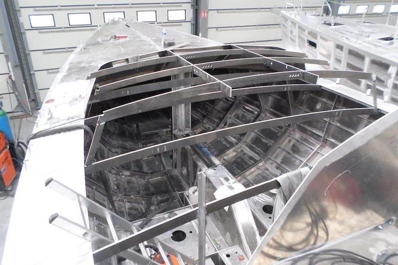 Slide: The Image of Boreal 47 yacht under construction, showcasing interior framework and metal structure, 2017 model. - 34