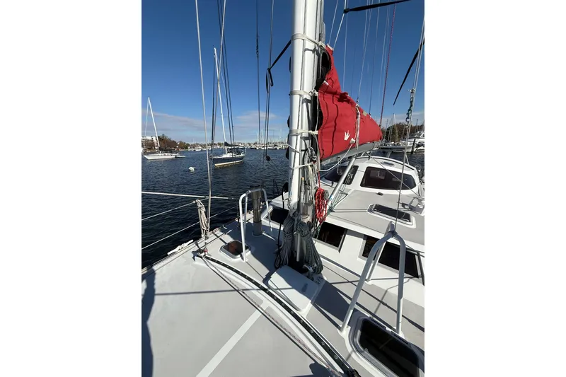 Slide: The Image of Sailboat Boreal 47, 2017 model, docked with red sail cover, clear sky. - 5
