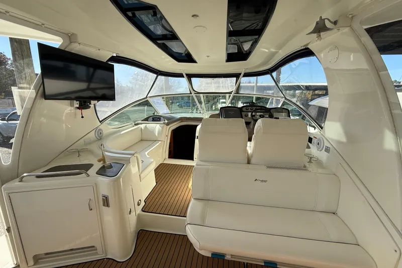 Slide: The Image of Luxurious 2008 Cruisers 455 Motor Yacht interior with seating, TV, and helm. - 11