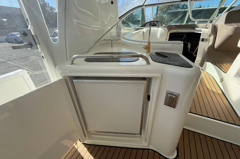 Slide: The Image of 2008 Cruisers 455 Motor Yacht interior with kitchenette and seating area. - 12