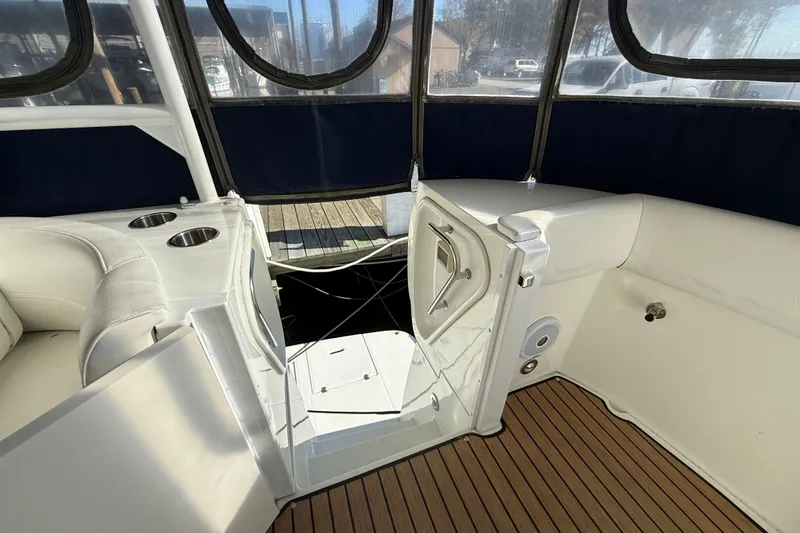 Slide: The Image of 2008 Cruisers 455 Motor Yacht interior with seating and cup holders. - 13
