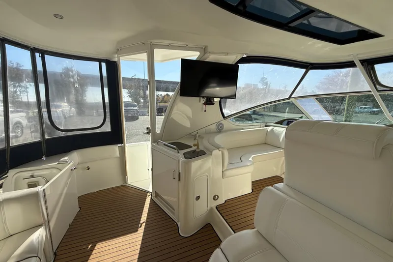 Slide: The Image of Luxurious interior of 2008 Cruisers 455 Motor Yacht with white seating and wood flooring. - 14