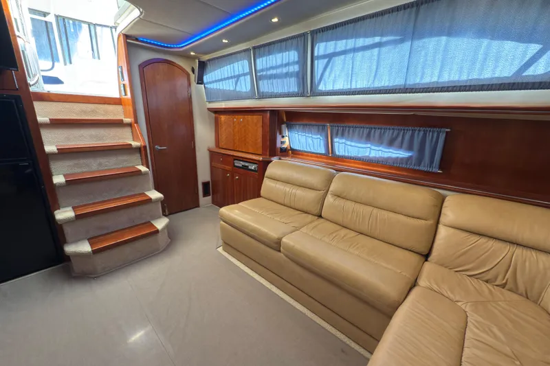 Slide: The Image of Luxurious interior of 2008 Cruisers 455 Motor Yacht with beige leather seating and wooden accents. - 17