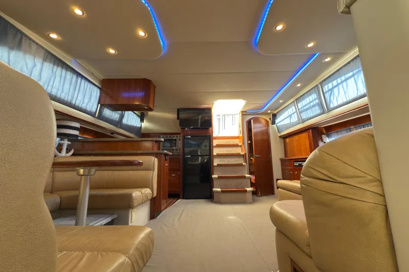 Slide: The Image of Luxurious interior of 2008 Cruisers 455 Motor Yacht with elegant seating and ambient lighting. - 19