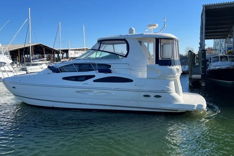 Slide: The Image of 2008 Cruisers 455 Motor Yacht docked at marina under clear blue sky. - 8
