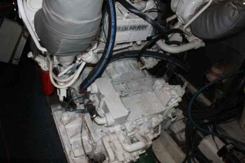 Slide: The Image of Engine room of 1999 Horizon 70 Motor Yacht with visible machinery and components. - 17