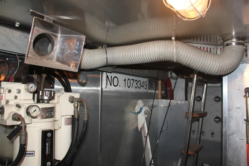 Slide: The Image of Engine room of 1999 Horizon 70 Motor Yacht with equipment and serial number. - 22