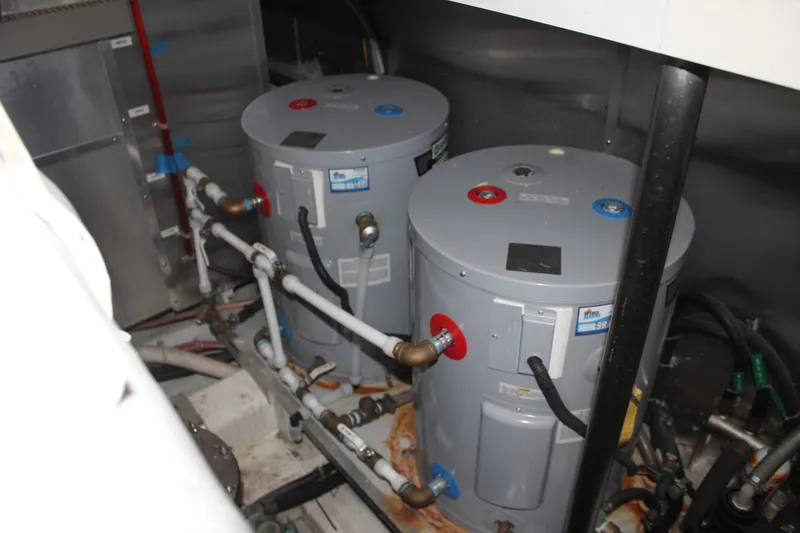 Slide: The Image of Engine room of 1999 Horizon 70 Motor Yacht with dual water heaters. - 24
