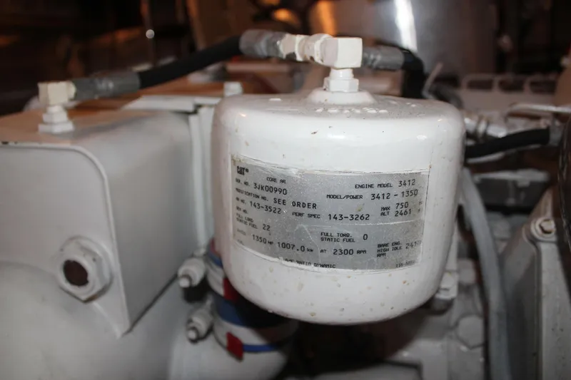 Slide: The Image of Engine component of 1999 Horizon 70 Motor Yacht, featuring CAT model 3412 specifications. - 27