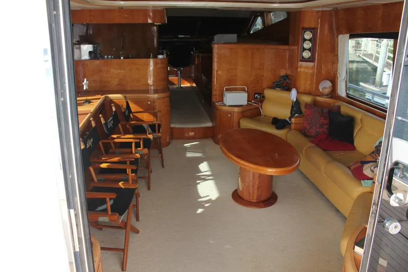 Slide: The Image of Luxurious interior of a 1999 Horizon 70 Motor Yacht with elegant wood finishes. - 32