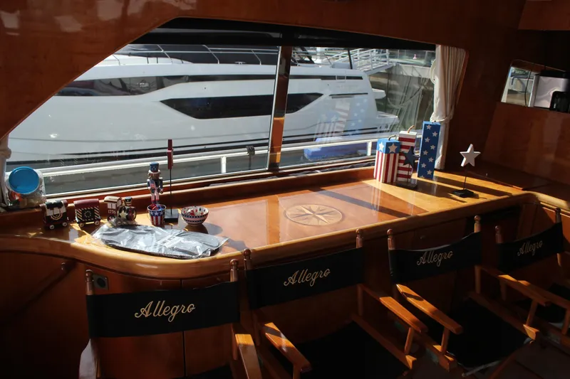 Slide: The Image of Interior of 1999 Horizon 70 Motor Yacht with decorative items and "Allegro" chairs. - 34