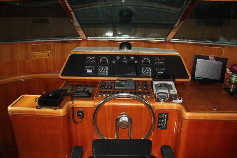 Slide: The Image of Cockpit of 1999 Horizon 70 Motor Yacht with wooden dashboard and navigation instruments. - 40