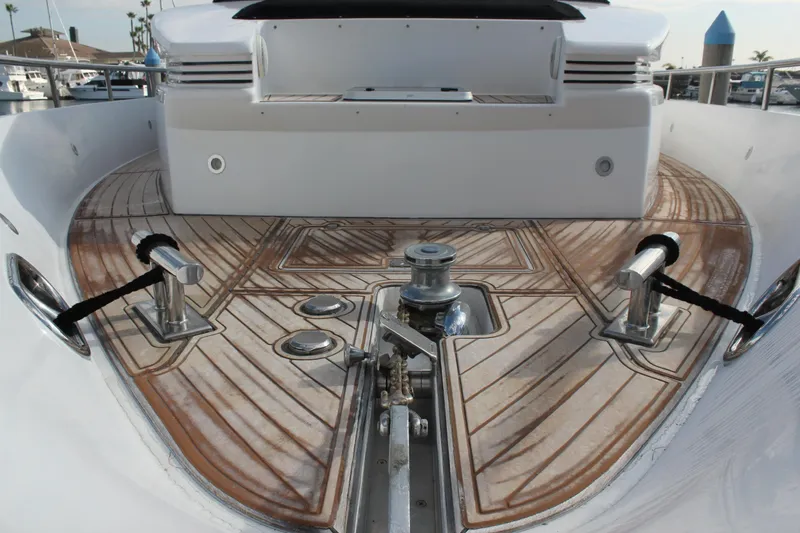 Slide: The Image of 1999 Horizon 70 Motor Yacht deck with polished wood and metal fittings. - 5