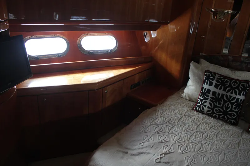 Slide: The Image of Luxurious cabin interior of 1999 Horizon 70 Motor Yacht with elegant wood finish. - 50