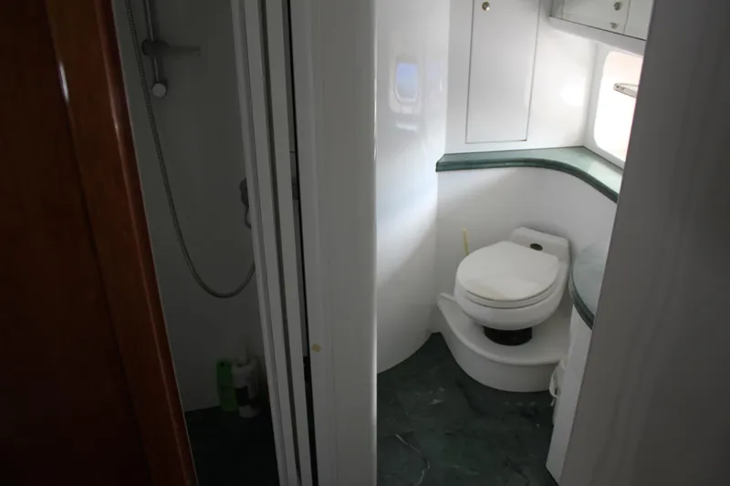Slide: The Image of Bathroom interior of 1999 Horizon 70 Motor Yacht with shower and toilet. - 51