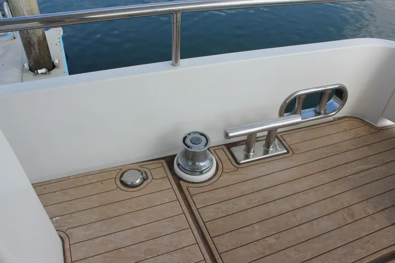 Slide: The Image of Deck of 1999 Horizon 70 Motor Yacht with cleat and winch. - 56