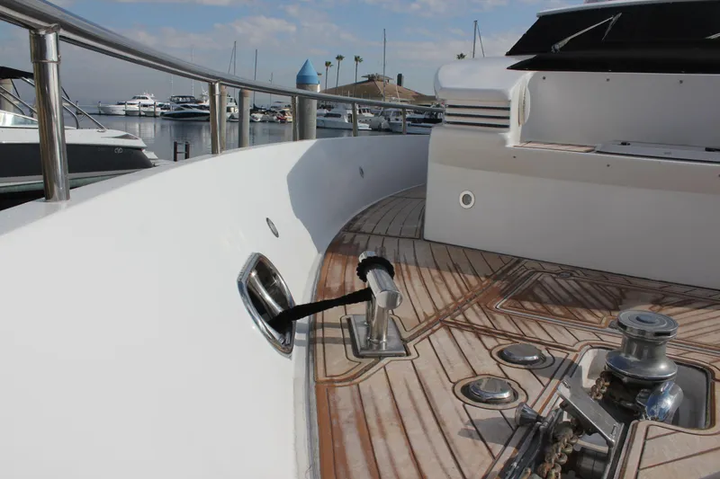 Slide: The Image of Deck view of 1999 Horizon 70 Motor Yacht in marina setting. - 6