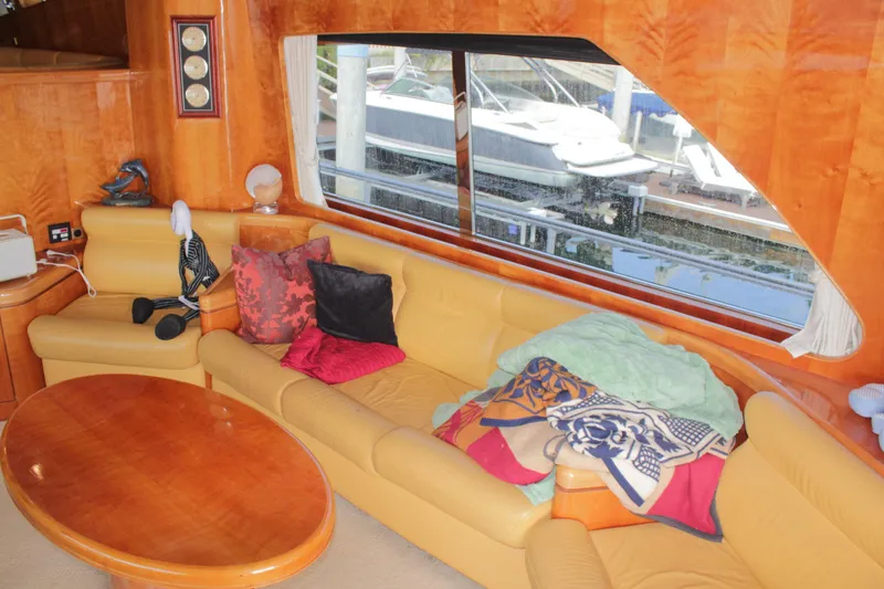 Slide: The Image of Luxurious interior of 1999 Horizon 70 Motor Yacht with plush seating and large window view. - 66