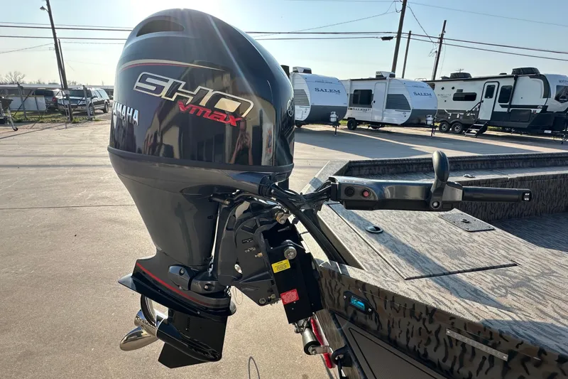 Slide: The Image of 2026 Xpress X18DB boat with Yamaha SHO VMAX outboard motor in a parking lot. - 7