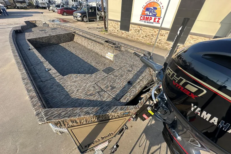 Slide: The Image of 2026 Xpress X18DB boat with Yamaha VMAX engine, parked at Camp EZ RV-Marine. - 9