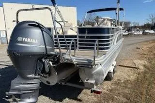 Slide: The Image of 2016 Bennington 2375 GCW pontoon boat with Yamaha outboard motor on a trailer. - 2