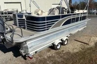 Slide: The Image of 2016 Bennington 2375 GCW pontoon boat on trailer, parked outdoors. - 4