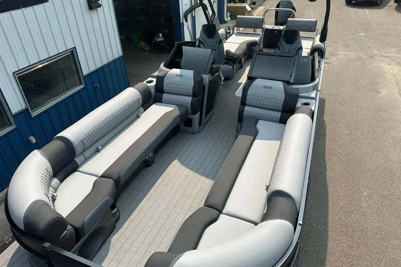 Slide: The Image of 2025 Avalon Excalibur LTD Quad Lounge Windshield boat with luxurious seating and modern design. - 10