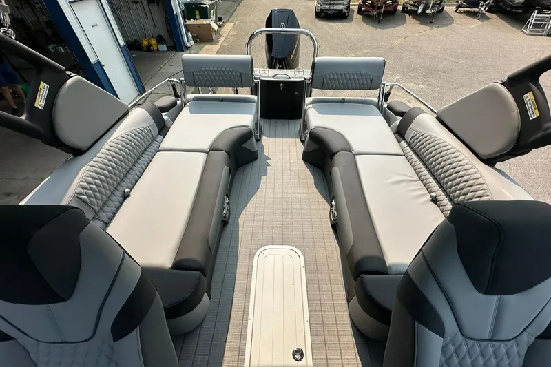 Slide: The Image of Luxurious interior of 2025 Avalon Excalibur LTD Quad Lounge Windshield boat, featuring plush seating. - 16