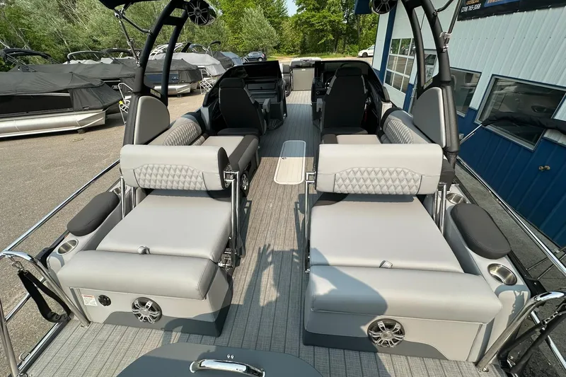 Slide: The Image of 2025 Avalon Excalibur LTD Quad Lounge Windshield boat interior with luxurious seating and modern design. - 18