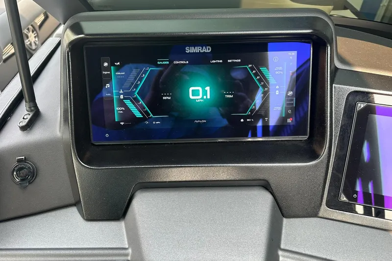 Slide: The Image of Dashboard display of 2025 Avalon Excalibur LTD Quad Lounge Windshield, showing speed and controls. - 23