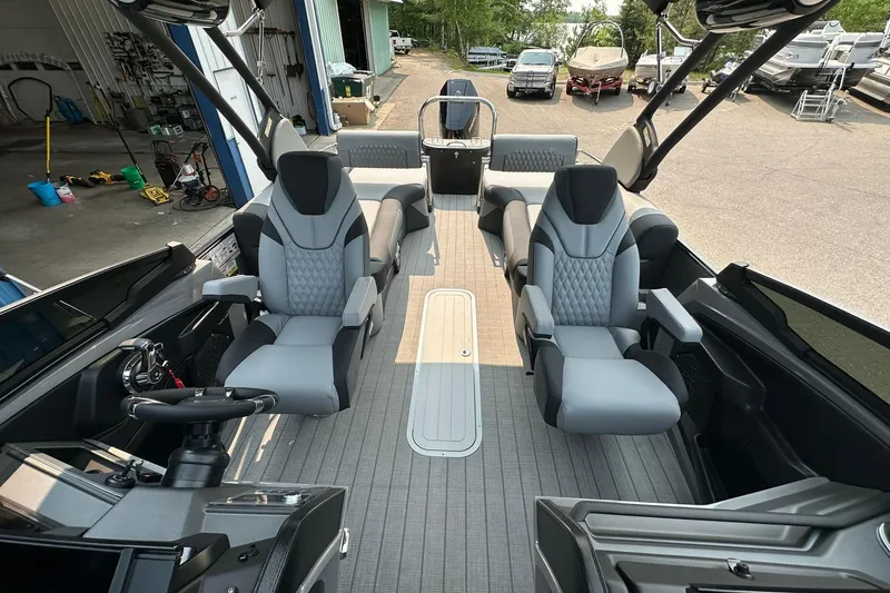 Slide: The Image of 2025 Avalon Excalibur LTD Quad Lounge Windshield boat interior with luxurious seating and modern design. - 29