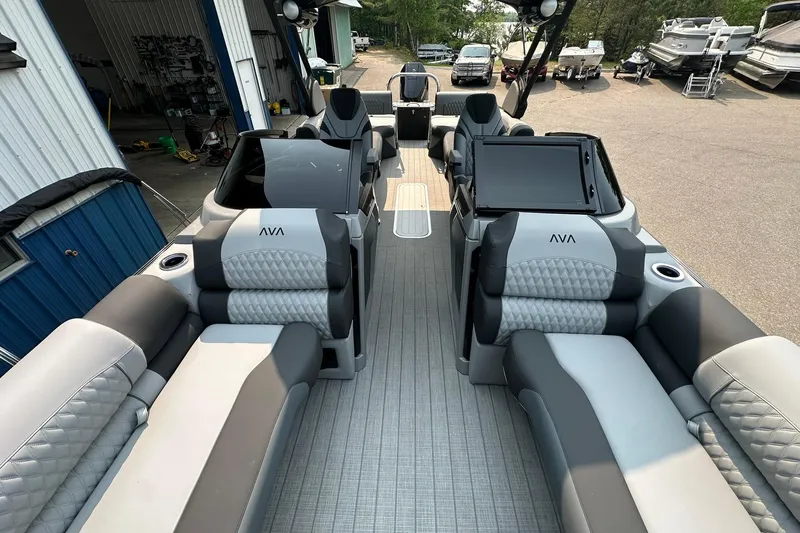Slide: The Image of 2025 Avalon Excalibur LTD Quad Lounge Windshield boat interior with luxurious seating and modern design. - 30