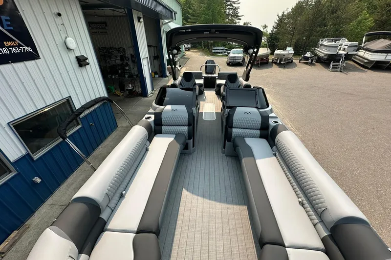 Slide: The Image of 2025 Avalon Excalibur LTD Quad Lounge Windshield boat with luxurious seating and modern design. - 32