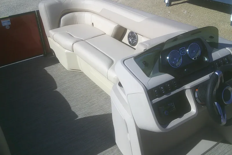 Slide: The Image of Interior of 2025 Godfrey Sweetwater 2086 Cruise Special Edition pontoon boat, featuring plush seating and modern dashboard. - 12