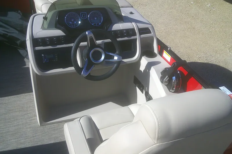 Slide: The Image of 2025 Godfrey Sweetwater 2086 Cruise Special Edition boat dashboard with steering wheel and controls. - 8
